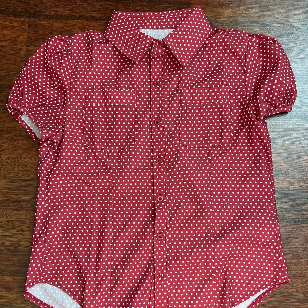 white and red polka dot blouse
